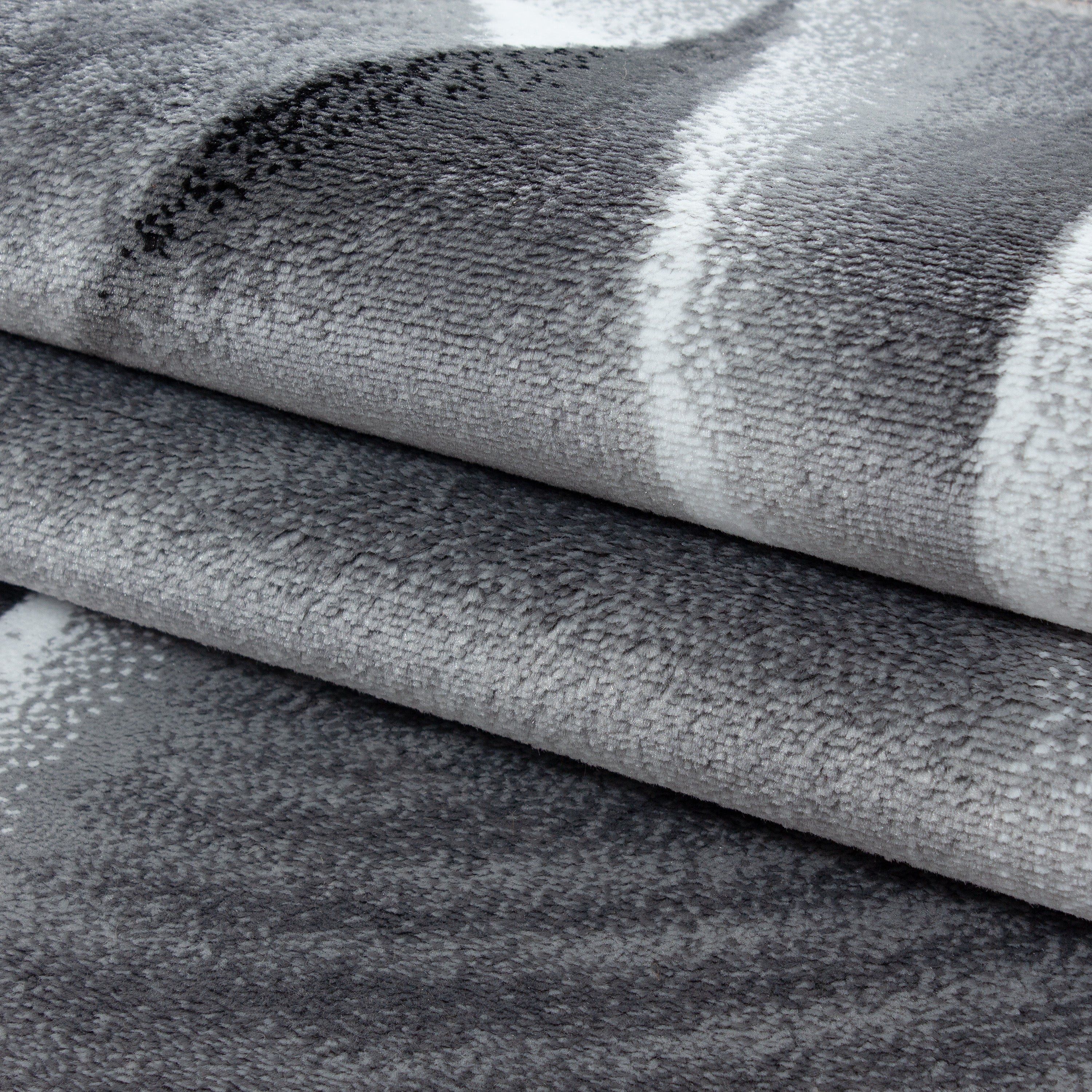 Teppich Kurzflor mit Muster - moderner Designer Teppich - abstraktes Muster, Licht Schatten Wellen - Grau Schwarz Meliert